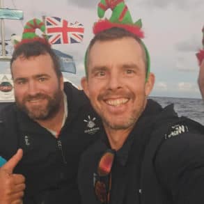 Paul Berry, Chris Mannion and Xavier Baker on the boat with Christmas hats