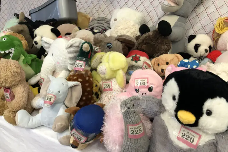 Soft toys laid out on the table at rotary sale