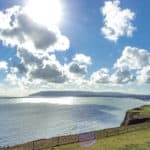 Looking down to Sandown Bay from Culver Cliff - blue sky in background