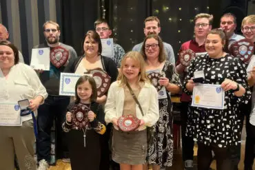 Vectis Corp of Drums award winners with their certificates and trophies