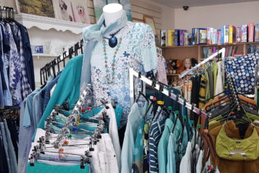 clothes on rails in the Wessex Cancer Support shop
