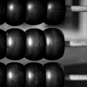 Black and white photo of a wooden abacus