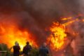 People watching a huge fire at the Gaiety Amusement Arcade in Ventnor