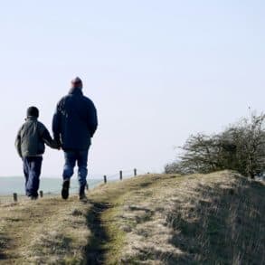Man and son walking in the countryside