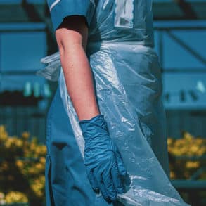 female care worker in blue outfit