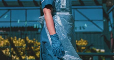 female care worker in blue outfit