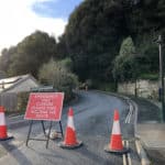 Road closed sign and boulder cliff fall in Lower Gills Cliff Road, Ventnor