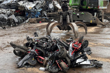 off road bikes and scooters ready to be crushed