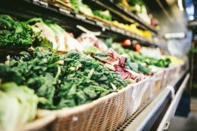 Aisle of vegetable in grocery store by scott warman