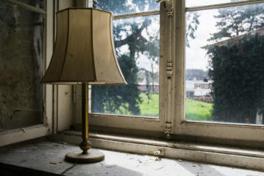Looking through the window of an empty property