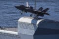 Royal Navy Cmdr. Nathan Gray, F-35 Integrated Test Force at NAS Patuxent River, Md., makes the first ever F-35B Lightning II takeoff from HMS Queen Elizabeth.