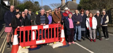David Groocock and residents gathered at the barriers at Leeson Road