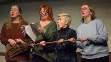 Four female actors on stage performing Lillies of the Land