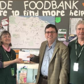 Michael presenting £370 to Ryde Foodbank to Ryde Foodbank team with Pippa Wayward, local resident in Ryde Appley and Elmfield Ward
