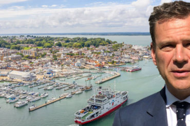 Red Funnel ferry leaving Cowes and Bob Seely MP in foreground
