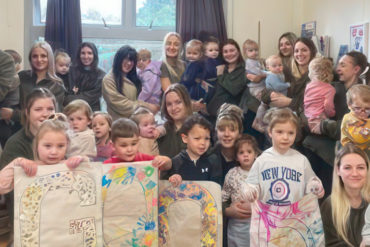 Staff and children at Tops Day Nursery