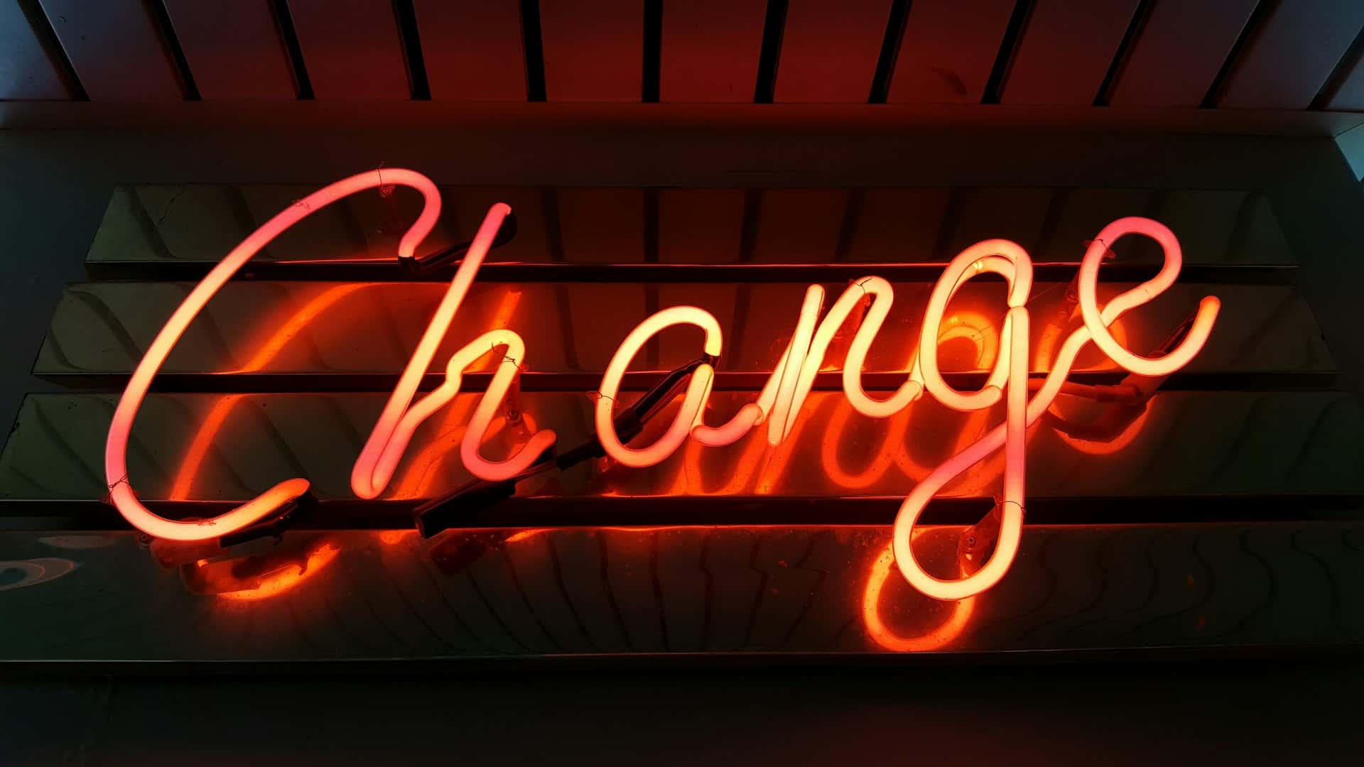 change written in orange neon