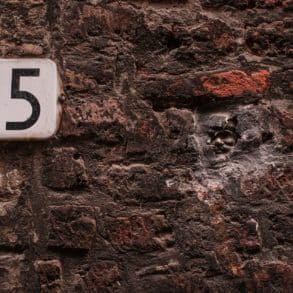 house number plate for 25 on brick wall