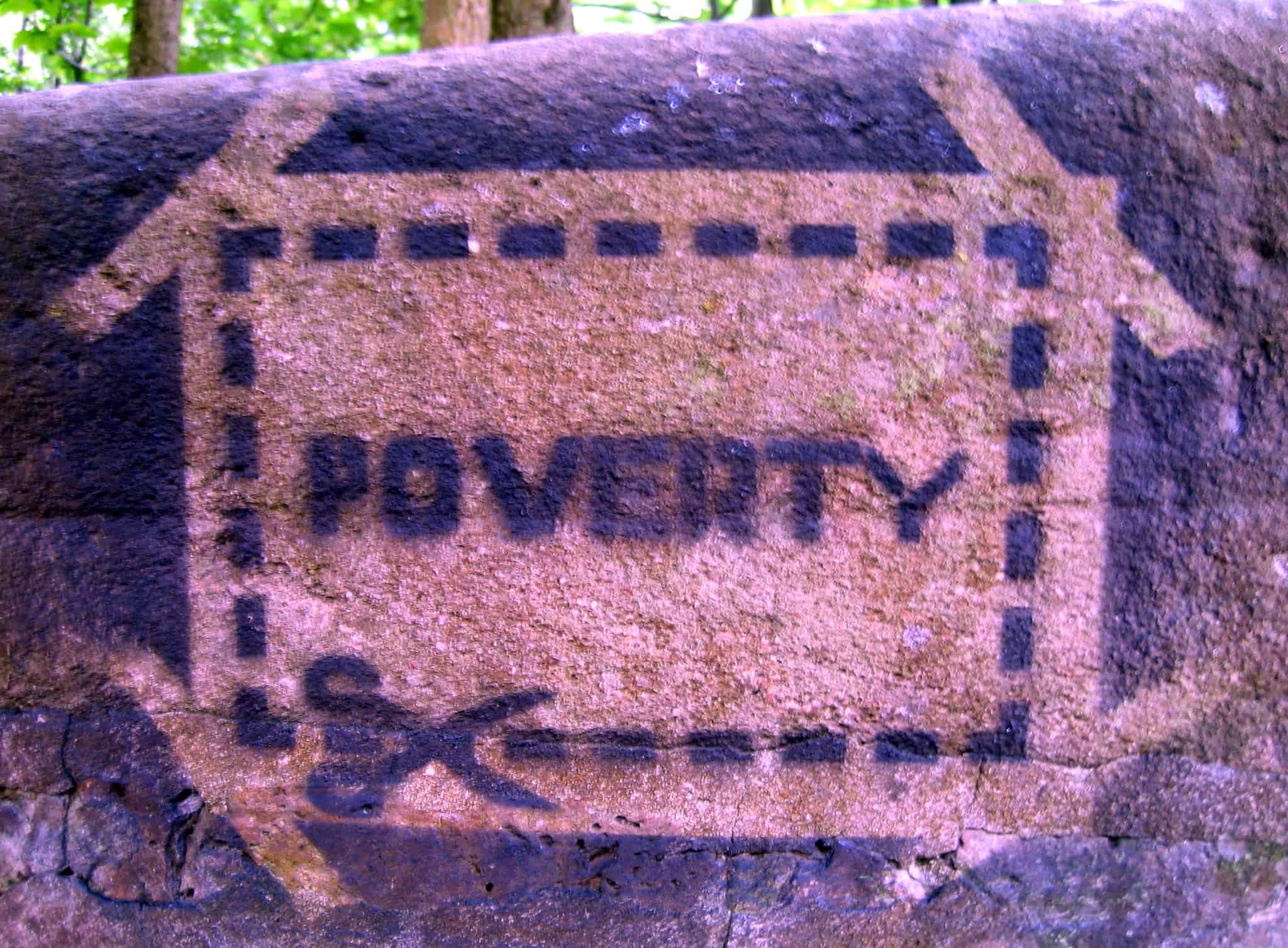 poverty stencil painted on wall