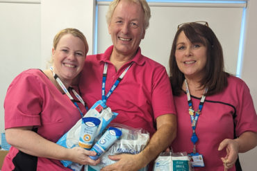 Age uk staff with Dignity packs