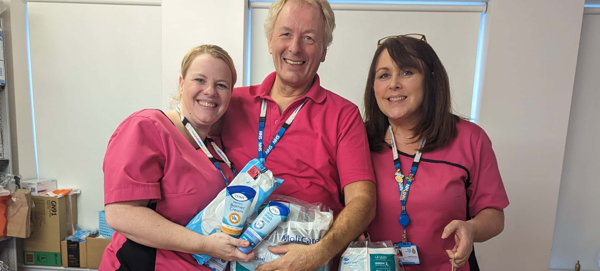 Age uk staff with Dignity packs
