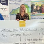 Volunteers from Motor Neurone Disease Association with giant cheque from IW Foundation