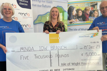 Volunteers from Motor Neurone Disease Association with giant cheque from IW Foundation