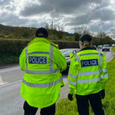 Roads Police Unit officers watching passing traffic at Blackwater