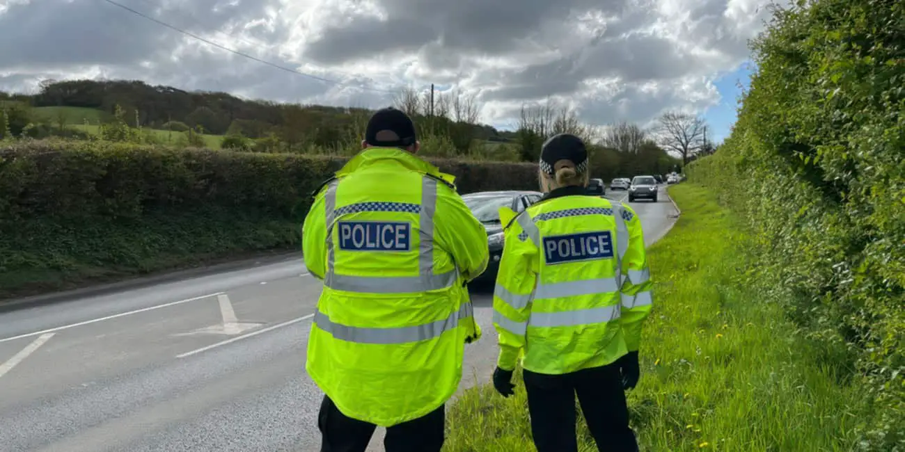 Roads Police Unit officers watching passing traffic at Blackwater