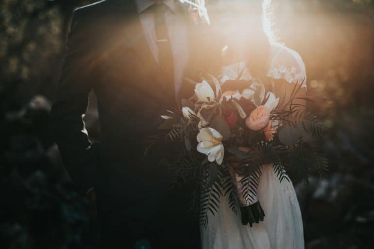 bride and groom in a misty light
