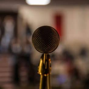 microphone with blurry background of meeting hall