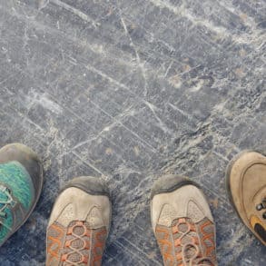 three people's walking boots by emma van sant