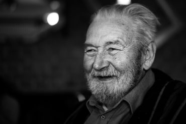 Black and white photo of older man smiling