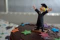 Graduation cake with sugar figure holding degree