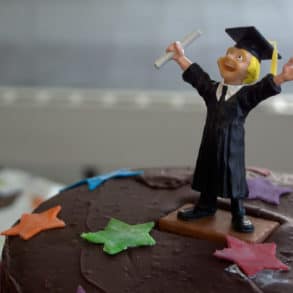 Graduation cake with sugar figure holding degree