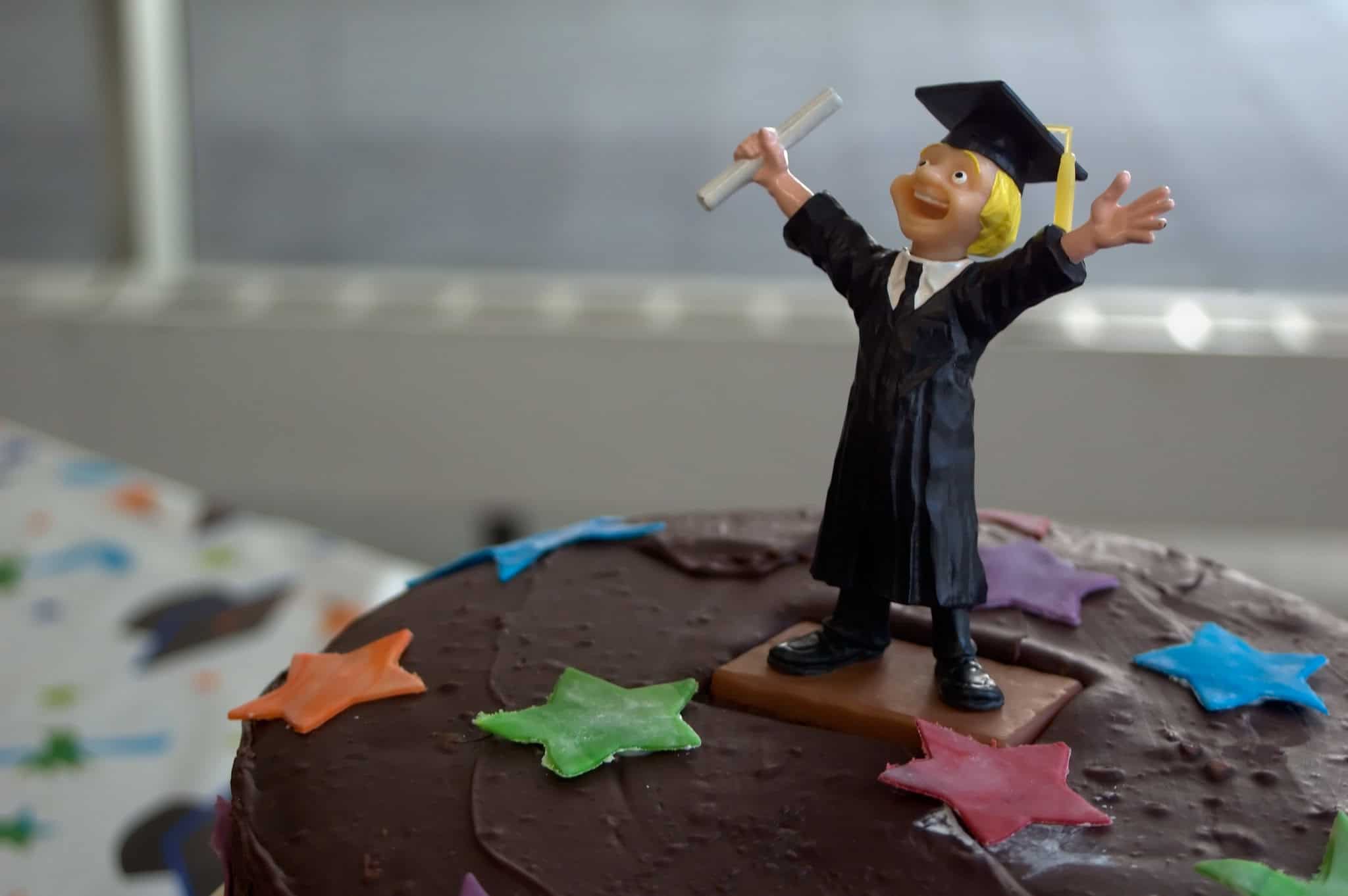 Graduation cake with sugar figure holding degree