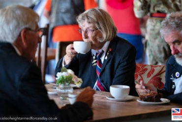 Veterans drinking tea at Isle of Wight Armed Forces Day 2023