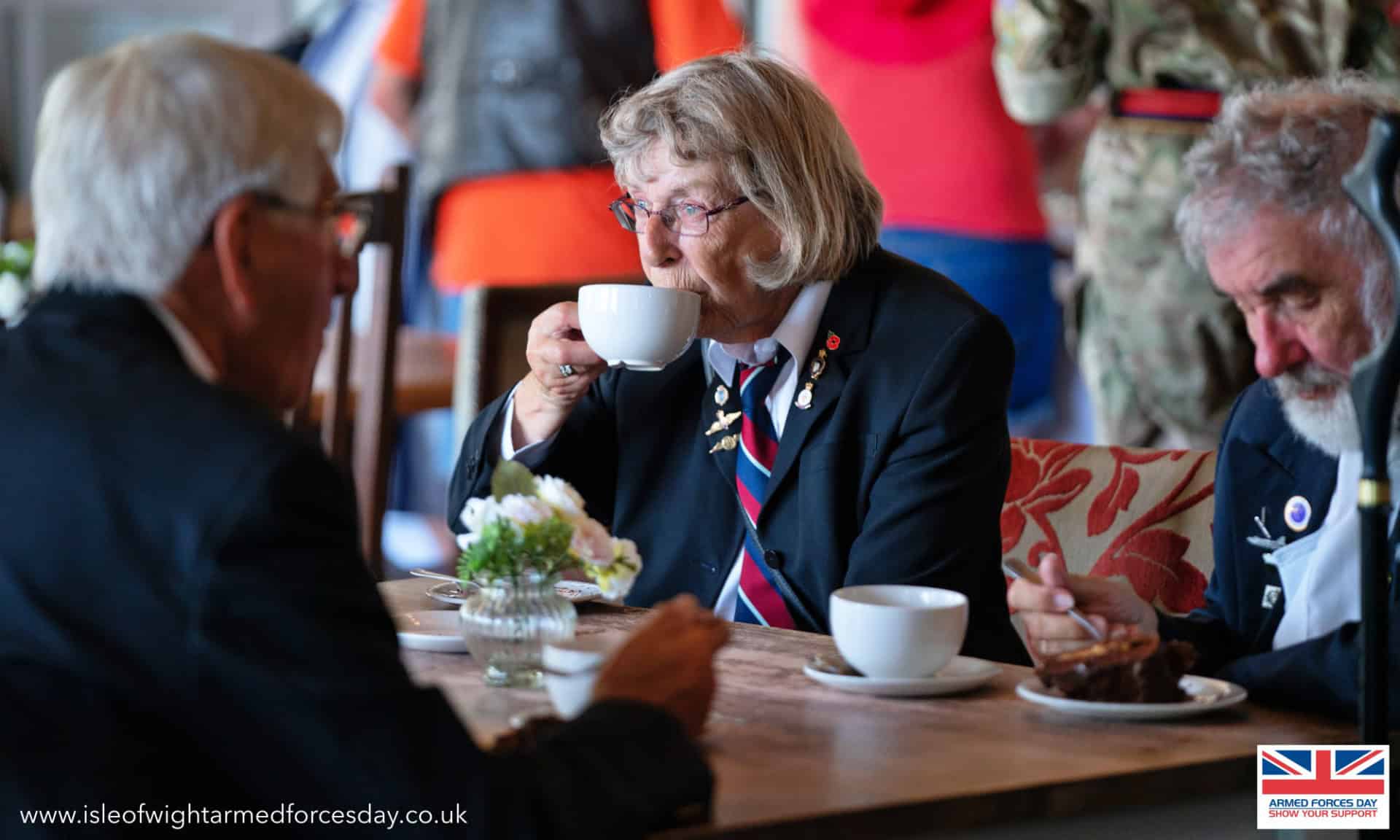 Veterans drinking tea at Isle of Wight Armed Forces Day 2023