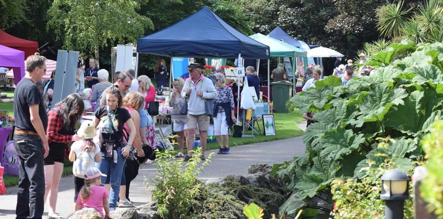 People milling around on Ventnor Day in Ventnor Park by Eloise Preston