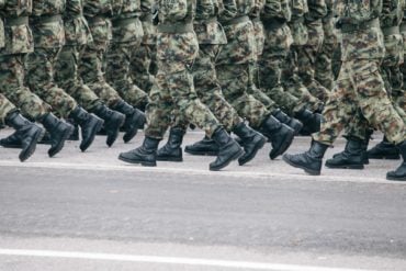shot of army soldiers marching