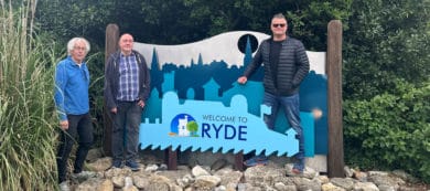 Councillors Malcolm Ross, Simon Cooke and Ian Dore standing by the 'welcome to Ryde sign'