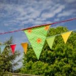 summer bunting hanging in the garden