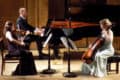 Galos piano trio performing on stage