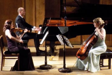 Galos piano trio performing on stage