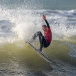 Jago Tasker surfing
