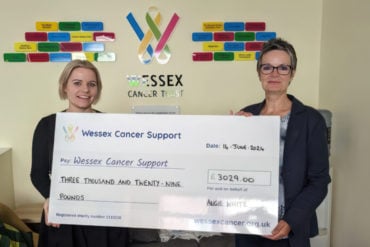 Laura Haytack and Angie White with a giant cheque