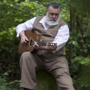 PAUL Armfield sitting among the trees with his guitar - Alice Armfield