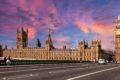 Parliament from westminster bridge with pink sunset in the background