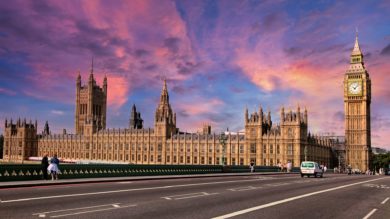 Parliament from westminster bridge with pink sunset in the background