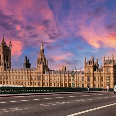 Parliament from westminster bridge with pink sunset in the background